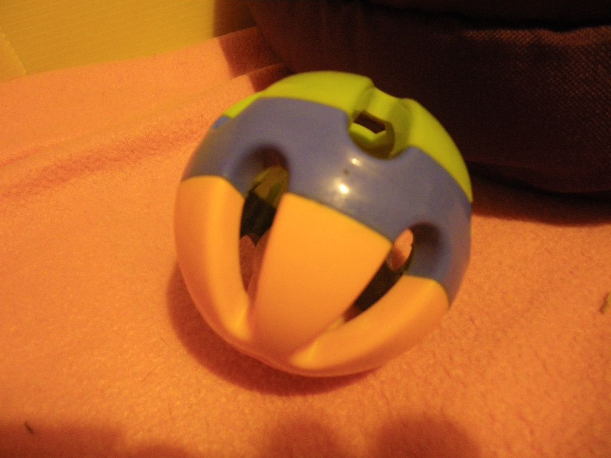 Plastic coloured ball, with bell inside.